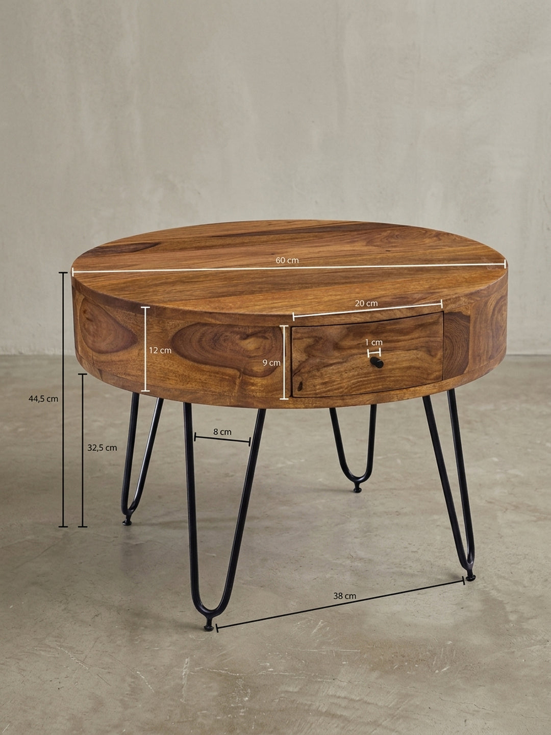 Detailansicht der Rückseite und Beinbefestigung des runden Kaffeetischs. Die robuste Konstruktion aus Massivholz und Metall sorgt für Stabilität des kleinen Couchtischs._