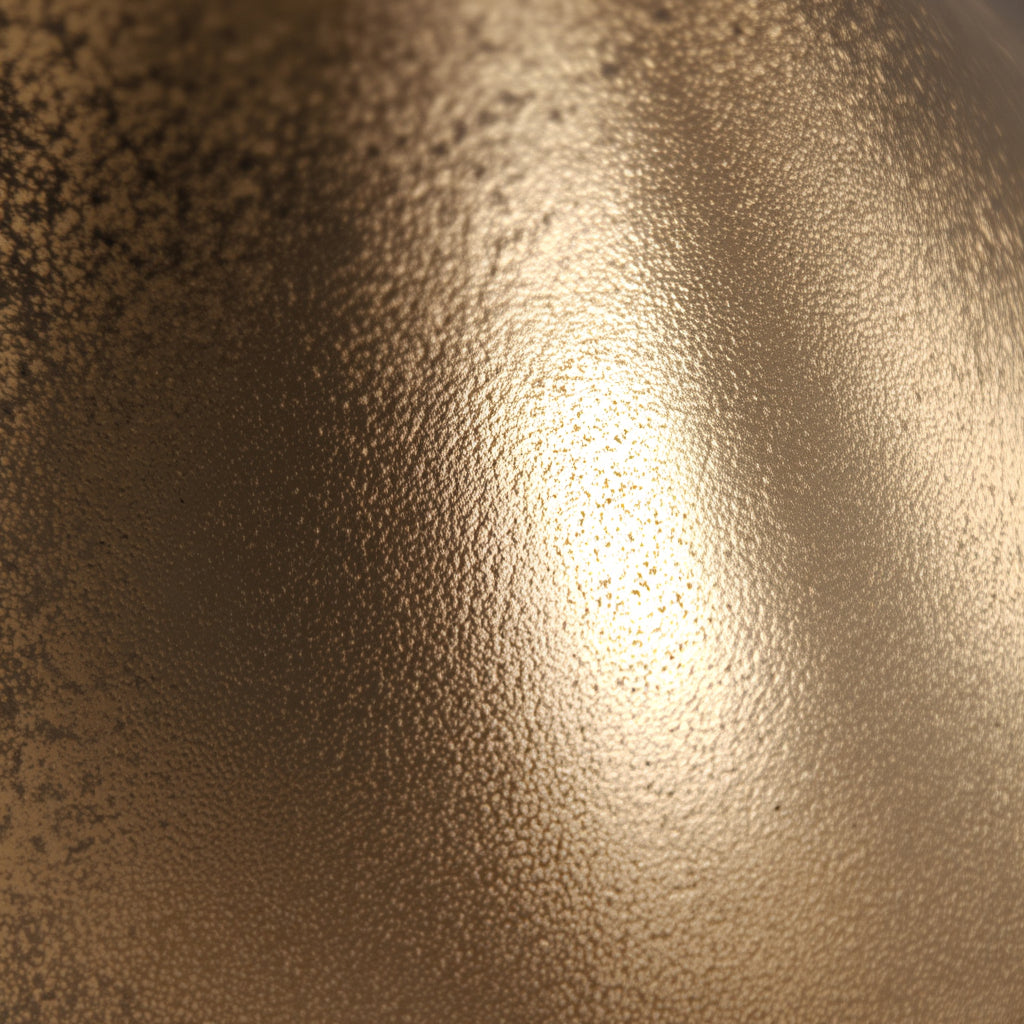 Detailaufnahme der goldenen Oberfläche mit feiner Struktur und edlem Glanz