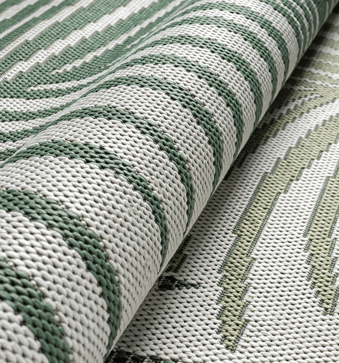 Grün Flachgewebe Teppich palmblätter als Blickfang im Raum BORNO Serie_