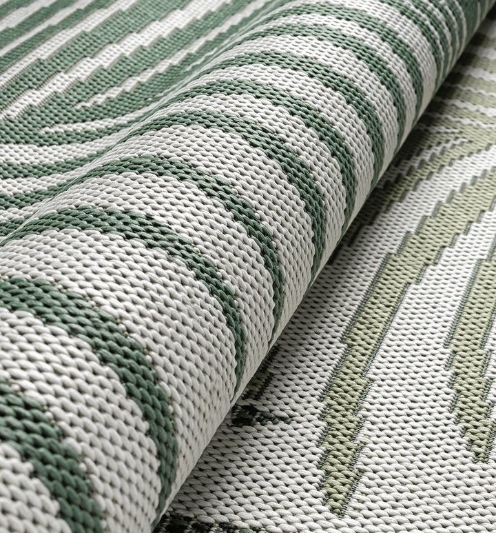 Grün Flachgewebe Teppich palmblätter als Blickfang im Raum BORNO Serie_