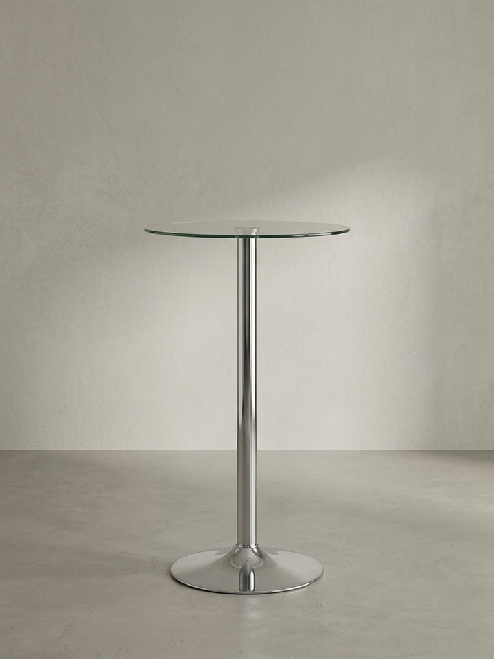 Runder Stehtisch aus klarem Sicherheitsglas und hochglänzend verchromtem Aluminium in Frontalansicht mit seinem charakteristischen, stabilen Trompetenfuß._