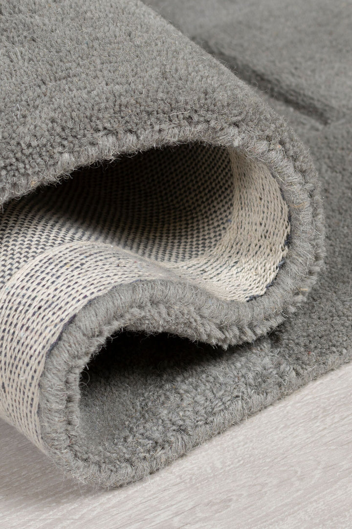 Wollteppich Geometrisch handgeschnitzt · 100 % Wolle getuftet · Plastisches Relief · 3200 g/m² Kurzflor