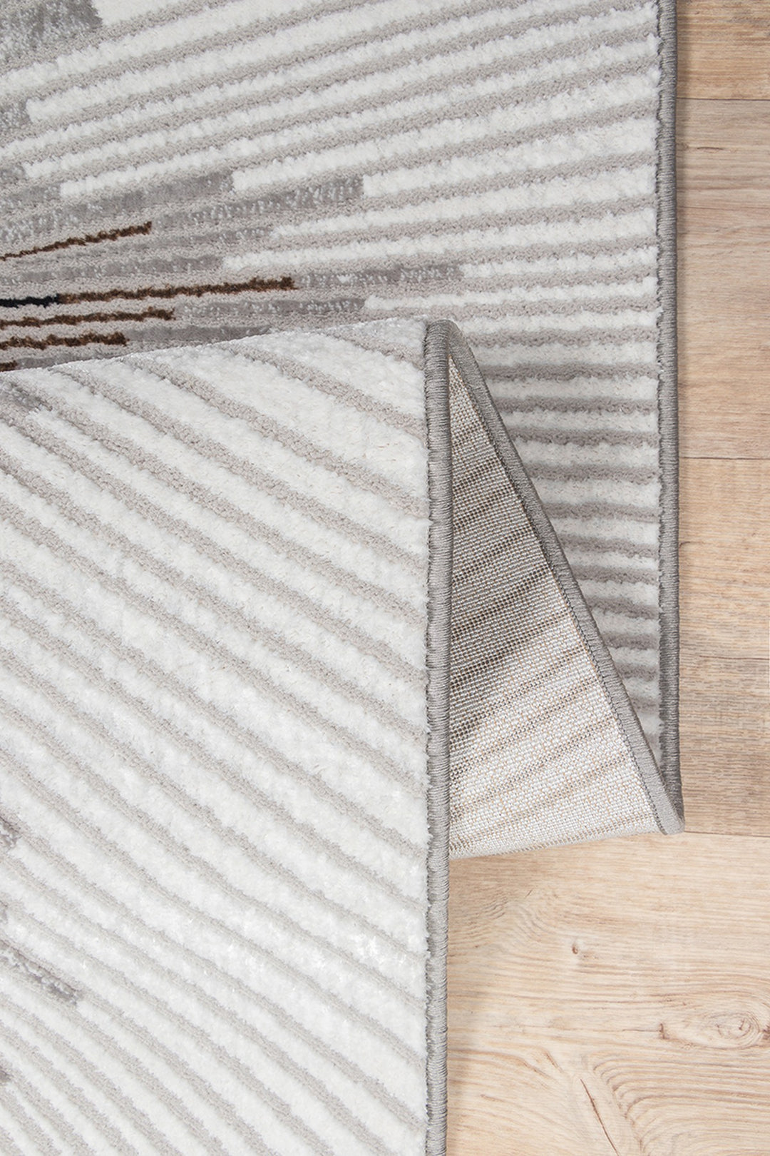 Kurzflor Teppich Grau abstrakt aus hochwertigem Polyester als moderner Wohnzimmerteppich KAVALA Serie_