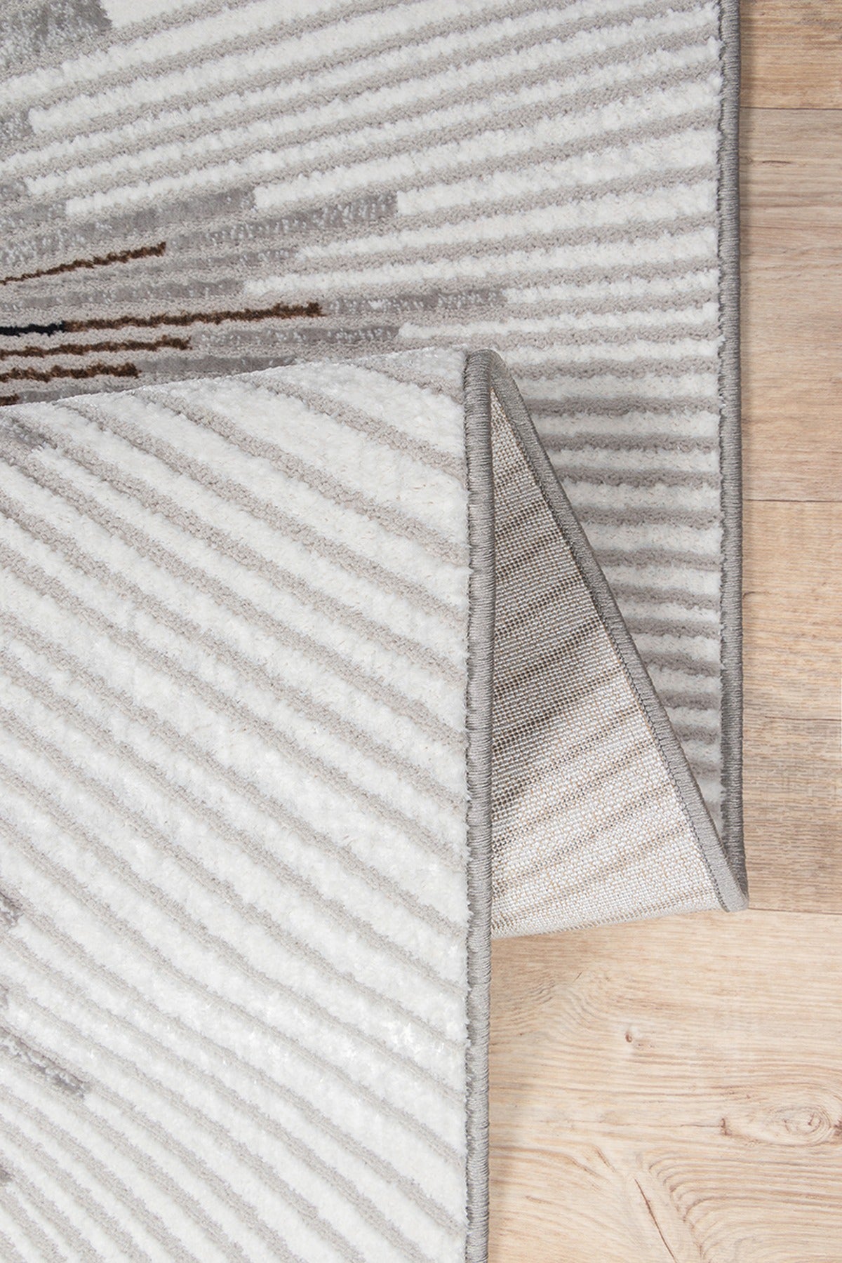 Kurzflor Teppich Grau abstrakt aus hochwertigem Polyester als moderner Wohnzimmerteppich KAVALA Serie