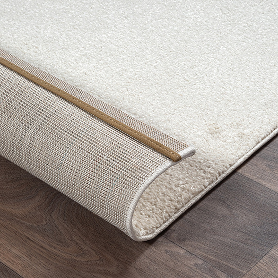 Kurzflorteppich Creme Abstrakt aus Polyester für puristische Einrichtung aus der MUOTA Kollektion_