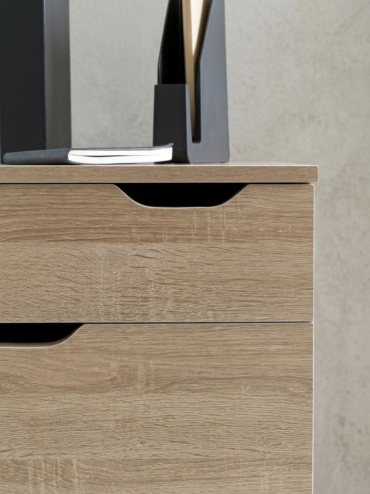 Grafik mit den genauen Maßen des Rollcontainers: Höhe 60 cm, Breite 40 cm, Tiefe 40 cm. Der Schubladenschrank in Eiche-Optik hat 4 Schubladen für Ihr Home-Office._