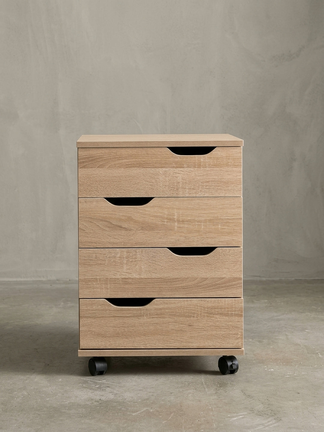 Nahaufnahme der ergonomischen Griffmulden und der präzisen Kantenverarbeitung am oberen Rand der Schubladen des modernen Büromöbels._