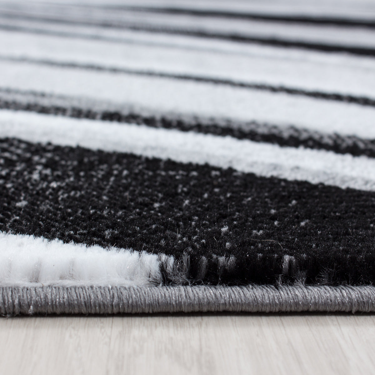 Kurzflor-Teppich Schwunglinien – Waschbar | Dynamisches Wellendesign | Heatset-Veredelung für Wolloptik – Ansicht 4