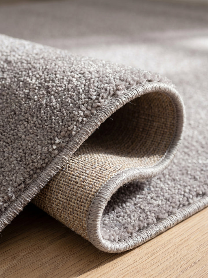 Teppich Beige rund Kante Rückseite_